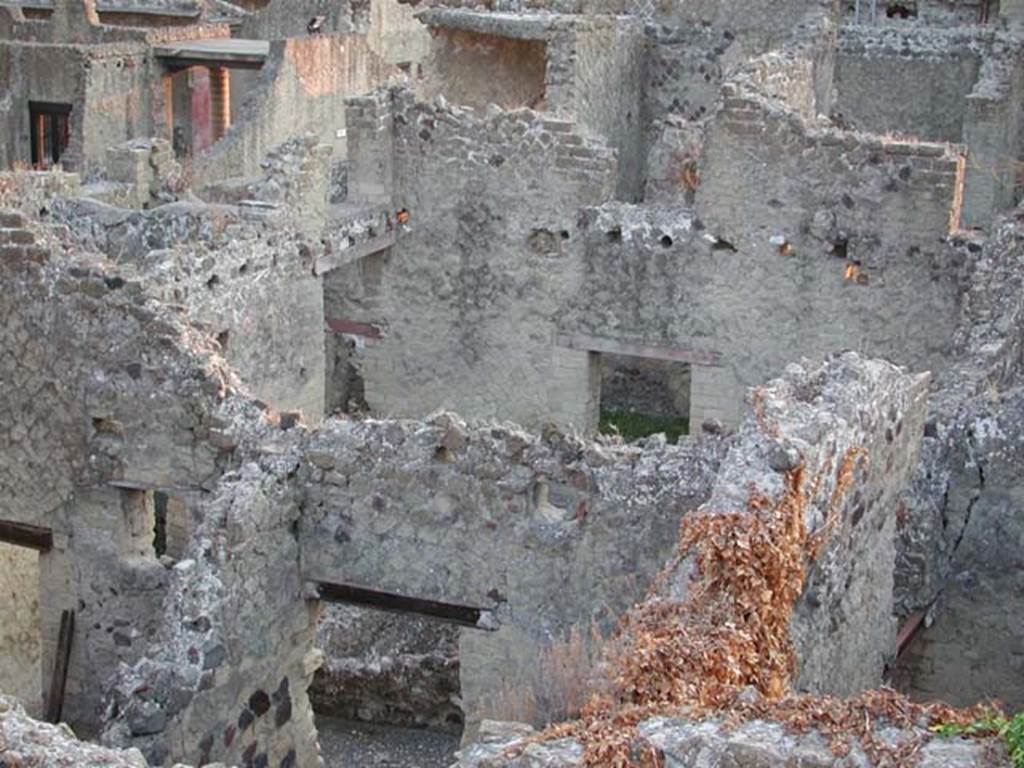 IV.18 Herculaneum, May 2004. General view taken from IV.13, with room 7 visible in the lower centre with doorway to the atrium, looking south.
Photo courtesy of Nicolas Monteix.